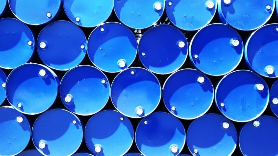 Rows of red industrial gas cylinders stored in a warehouse setting, representing the regulated storage and inspection requirements for refrigerant cylinders under EPA counterfeit refrigerant compliance rules